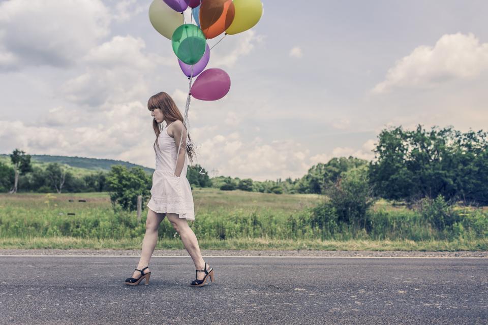 A woman walking a country path