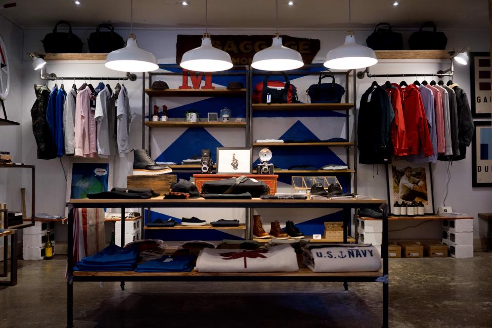 A wool coat hanging by the door